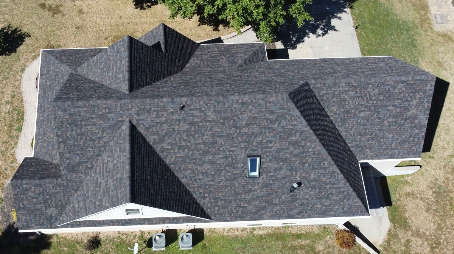 Residential roof replacement — dark shingles aerial view