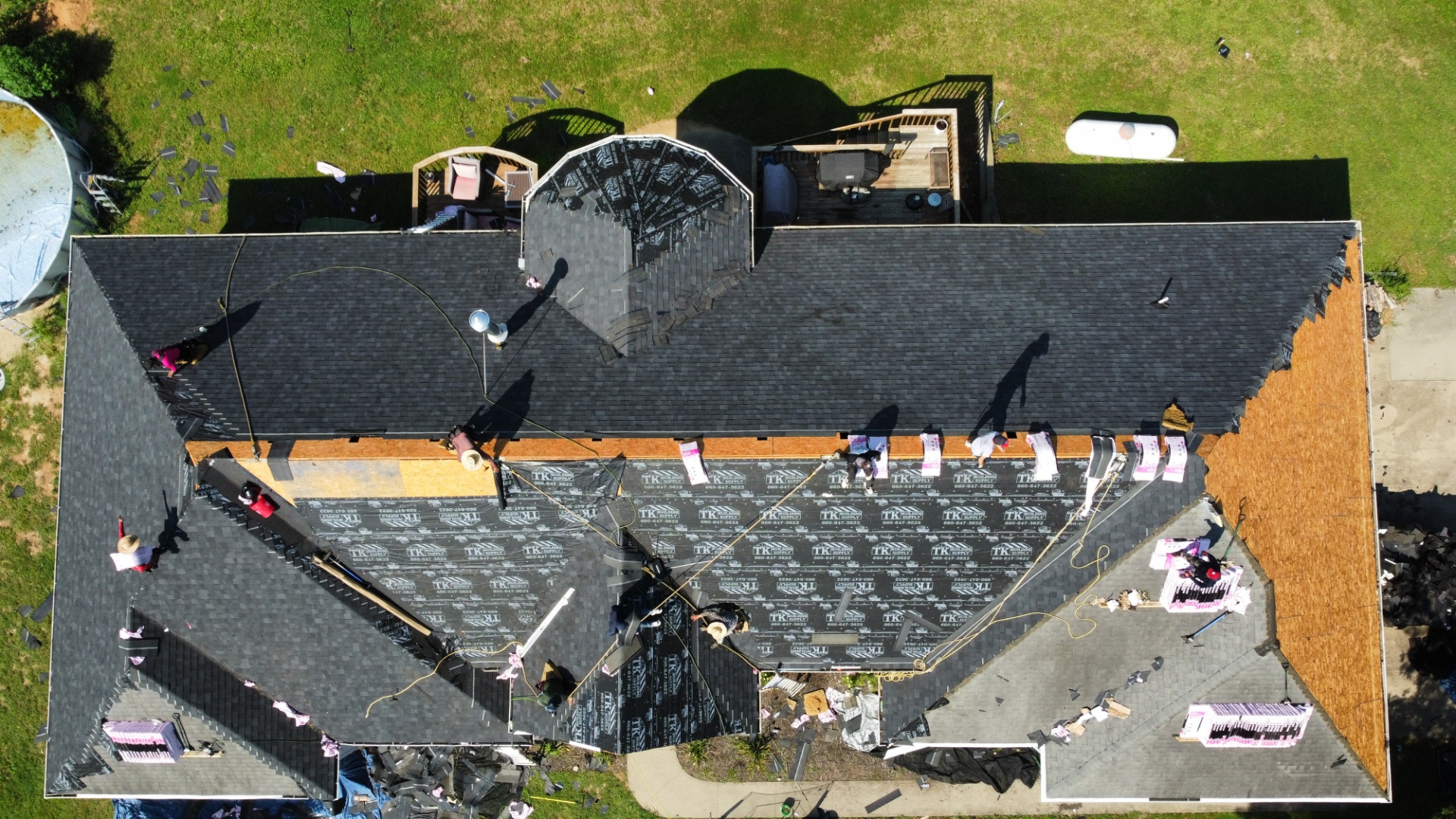 Blue Ox roofing crew mid-installation on a residential roof in Central Missouri